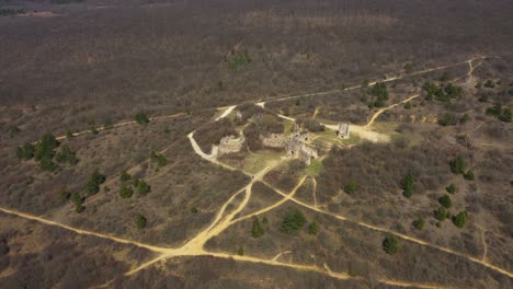 High-altitude-drone-footage-from-ruins-of-an-castle-in-Pilisborojeno,-Hungary