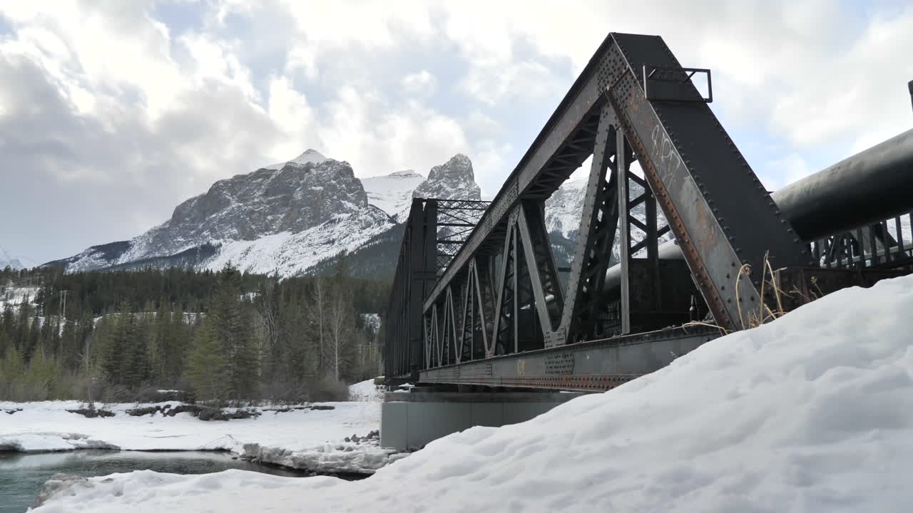 Cinematic Shot of Old Bridge over Clear Water in Alberta.