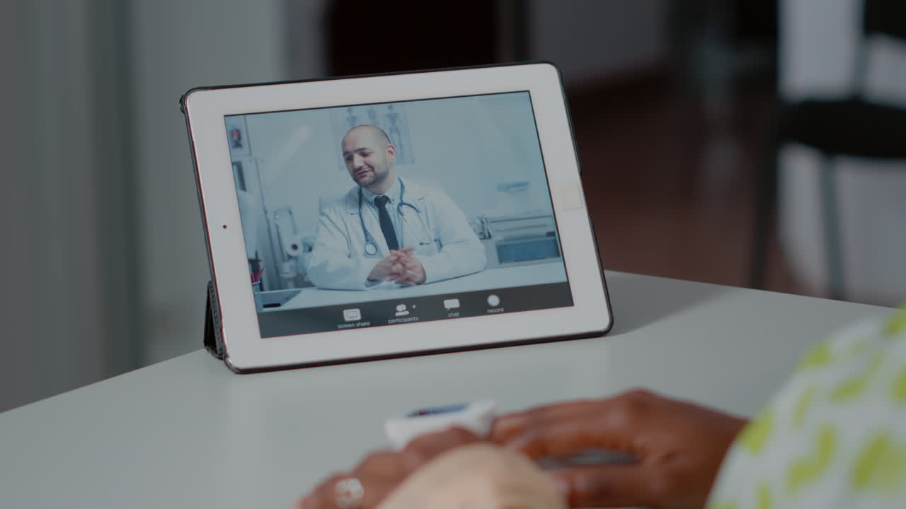Close up of video call with doctor on digital tablet