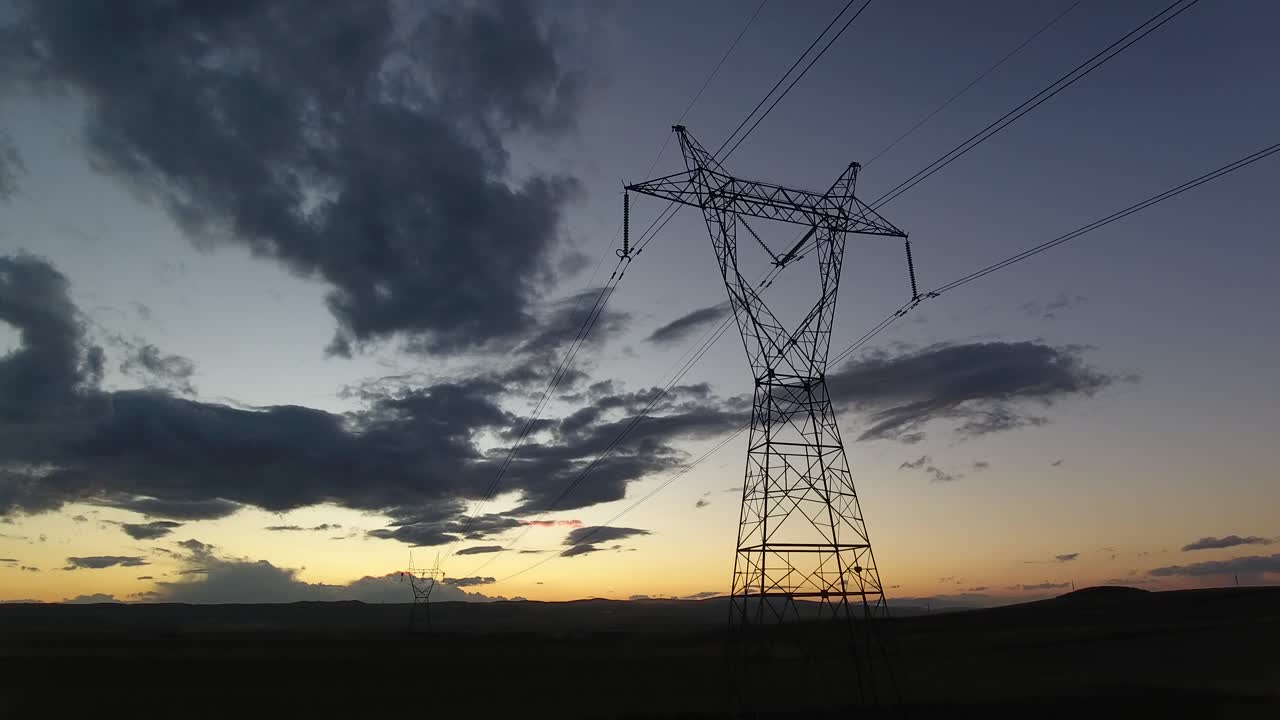 Transmission Tower front of a Beautiful Sunset Landscape