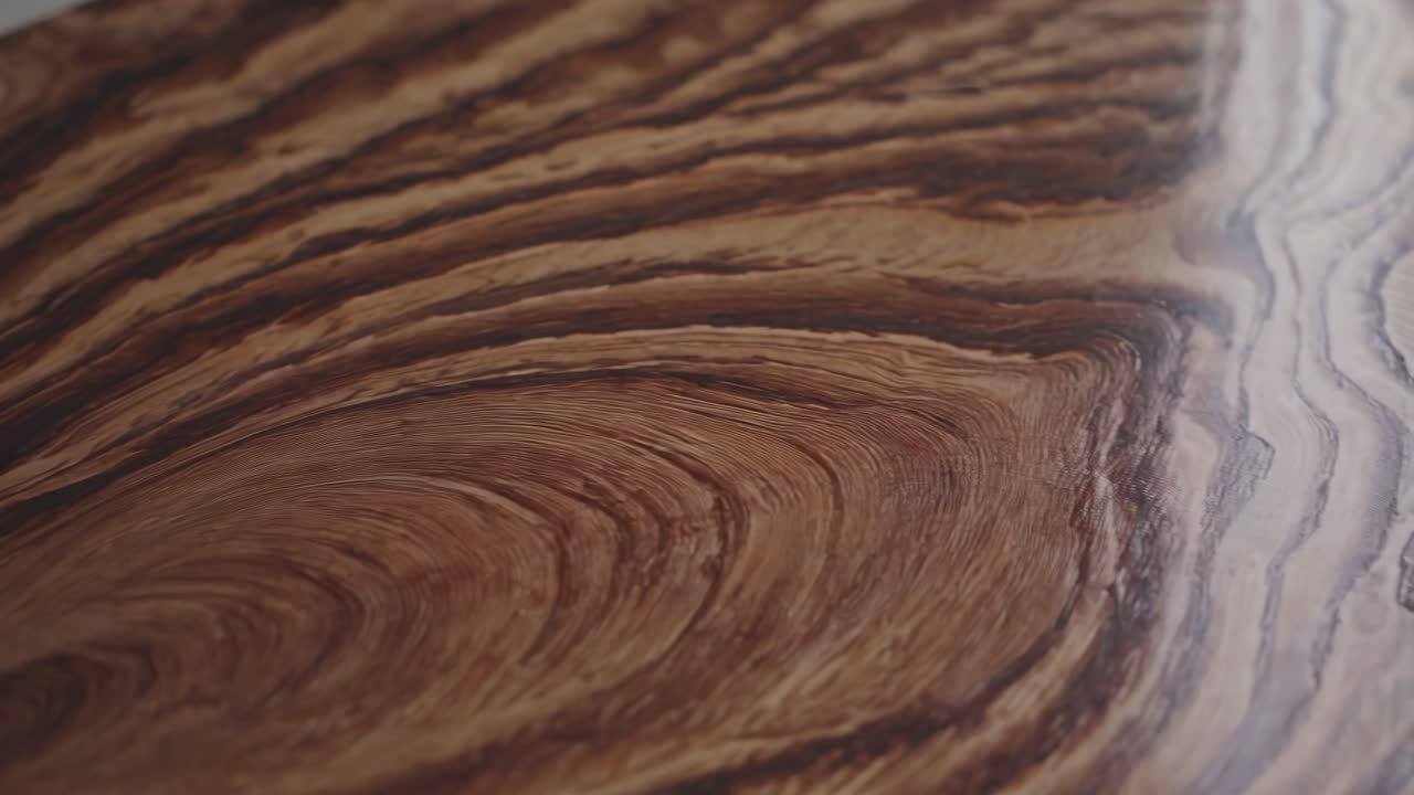 Close-up video of wood grain patterns, capturing intricate textures and swirls