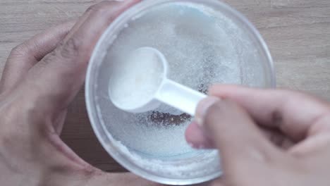 measuring sugar with a spoon