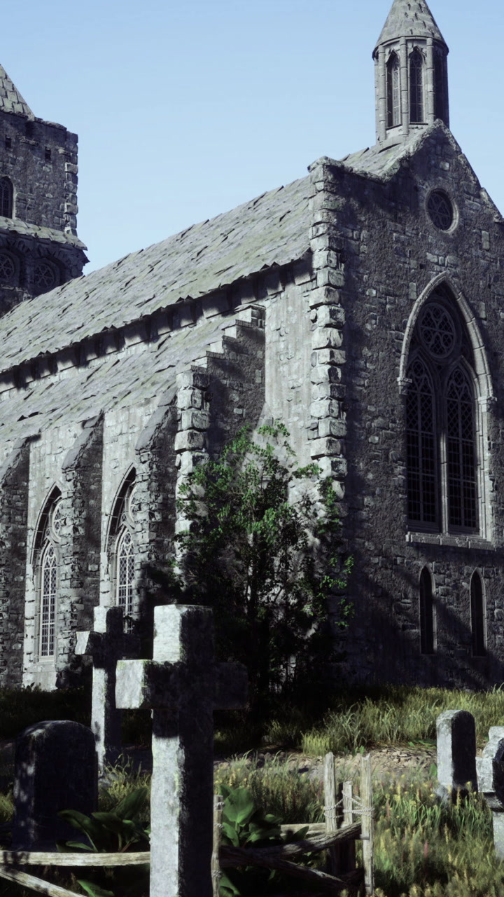 Storica chiesa in pietra circondata da lapidi e antiche rovine all'alba
