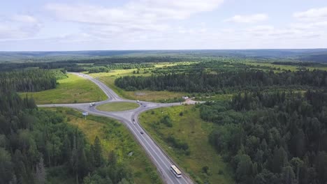 aerial view of a country road intersection with roundabout