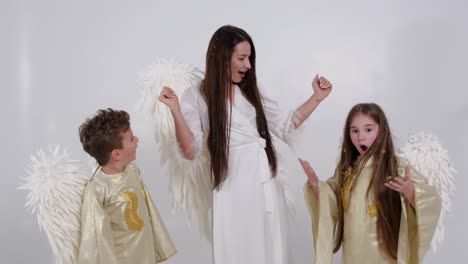 people angels with wings on a white background in the studio people angels with wings on a white background in the studio video