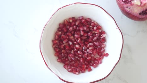 pomegranate seeds in a bowl
