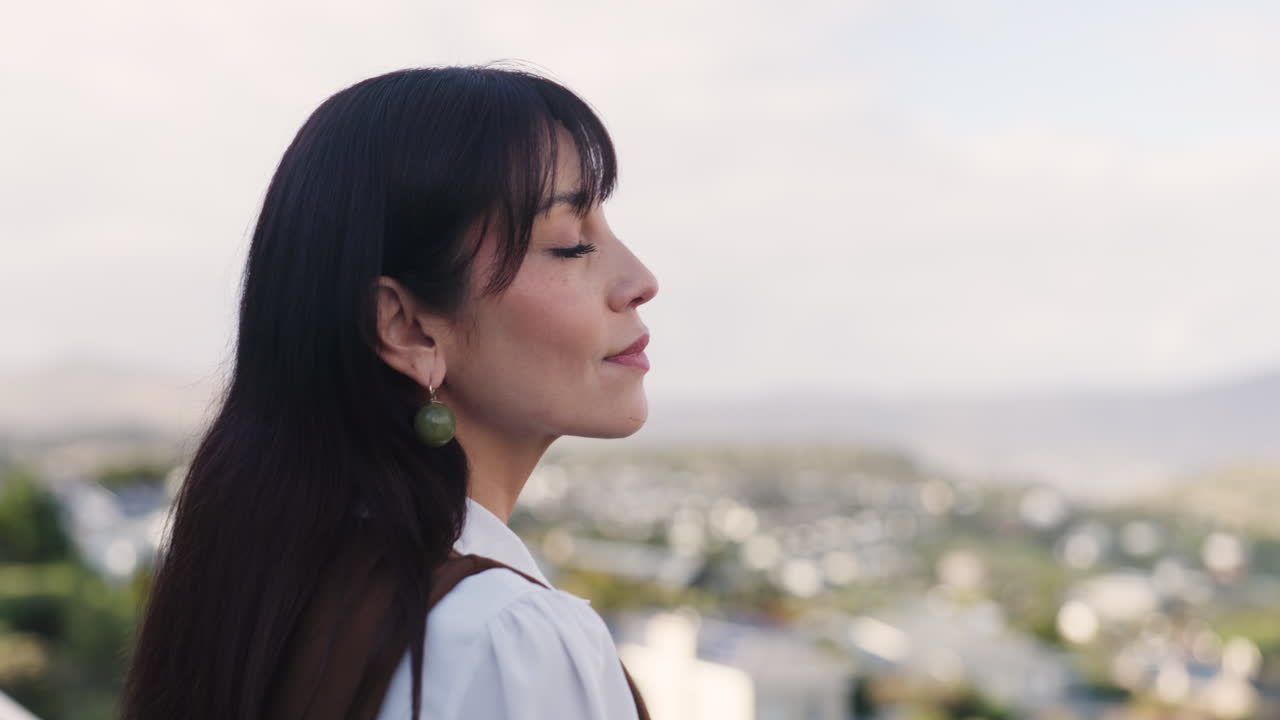 A woman looking over a cityscape