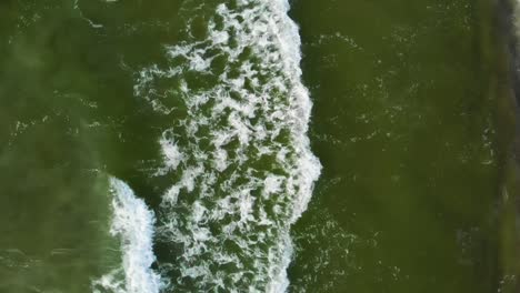 AERIAL:-Slowly-Lifting-up-in-the-Air-Above-the-Sandy-Beach-near-the-Baltic-Sea,-Slow-Motion,-High-Speed-Camera,-60-FPS