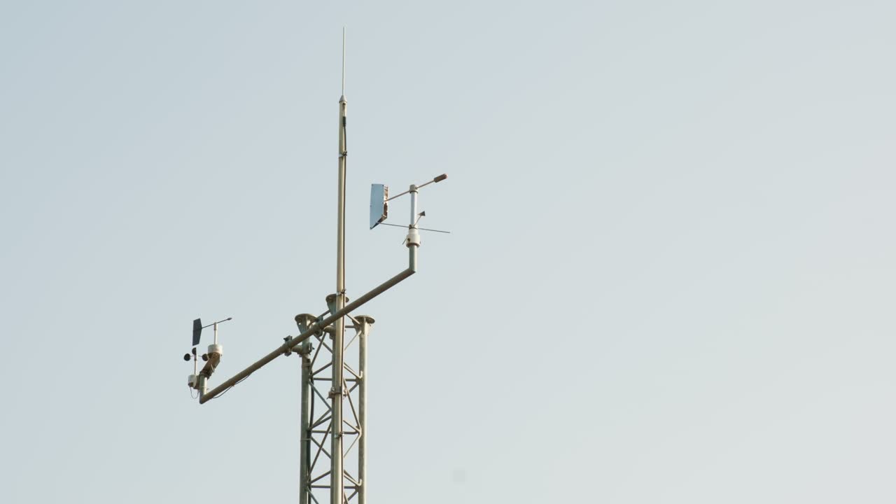 Antennas collecting data on tower of weather station