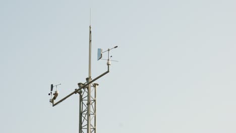 antennas collecting data on tower of weather station