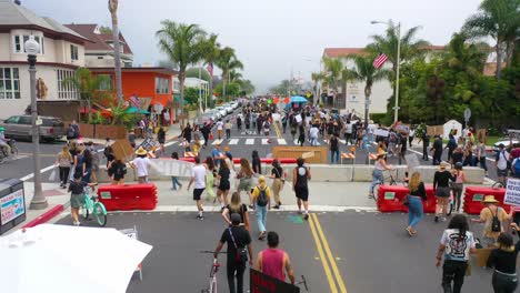 aerial over crowds large black lives matter blm protest march marching through a small town ventura california 3