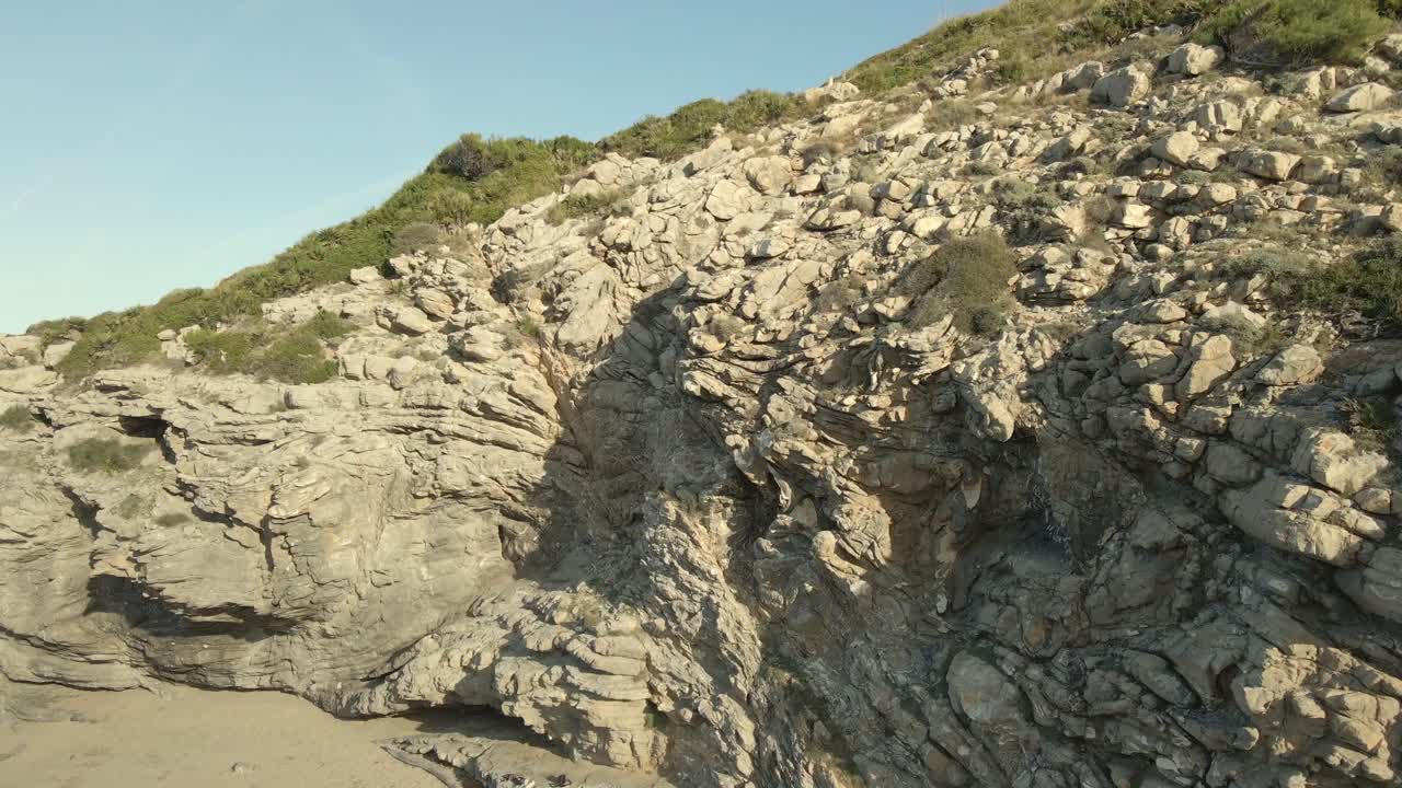 Explore the stunning rock formations surrounding Cala Torta, a serene beach located in Majorca. Ideal for nature lovers and adventure seekers looking for hidden beauty.