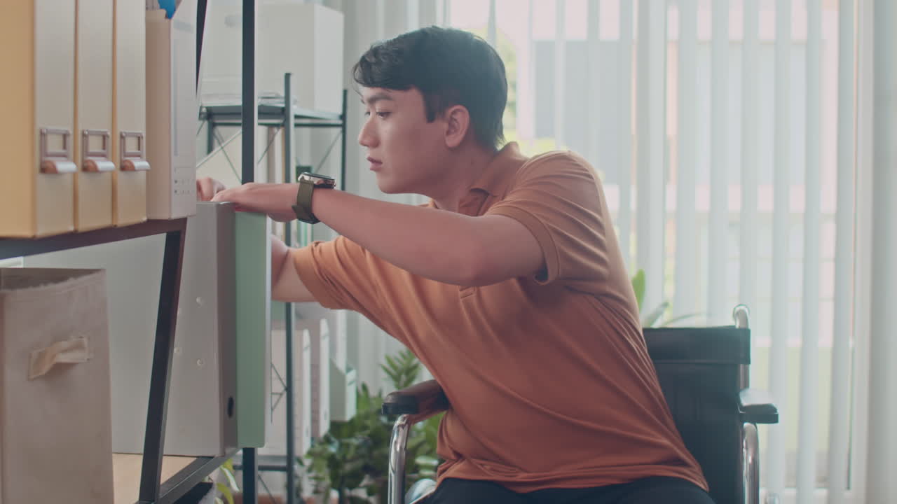 Programmer with Disability Looking for Document at Office