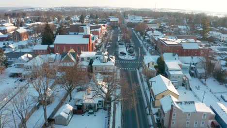 aerial dolly shot approaching town square in winter snow