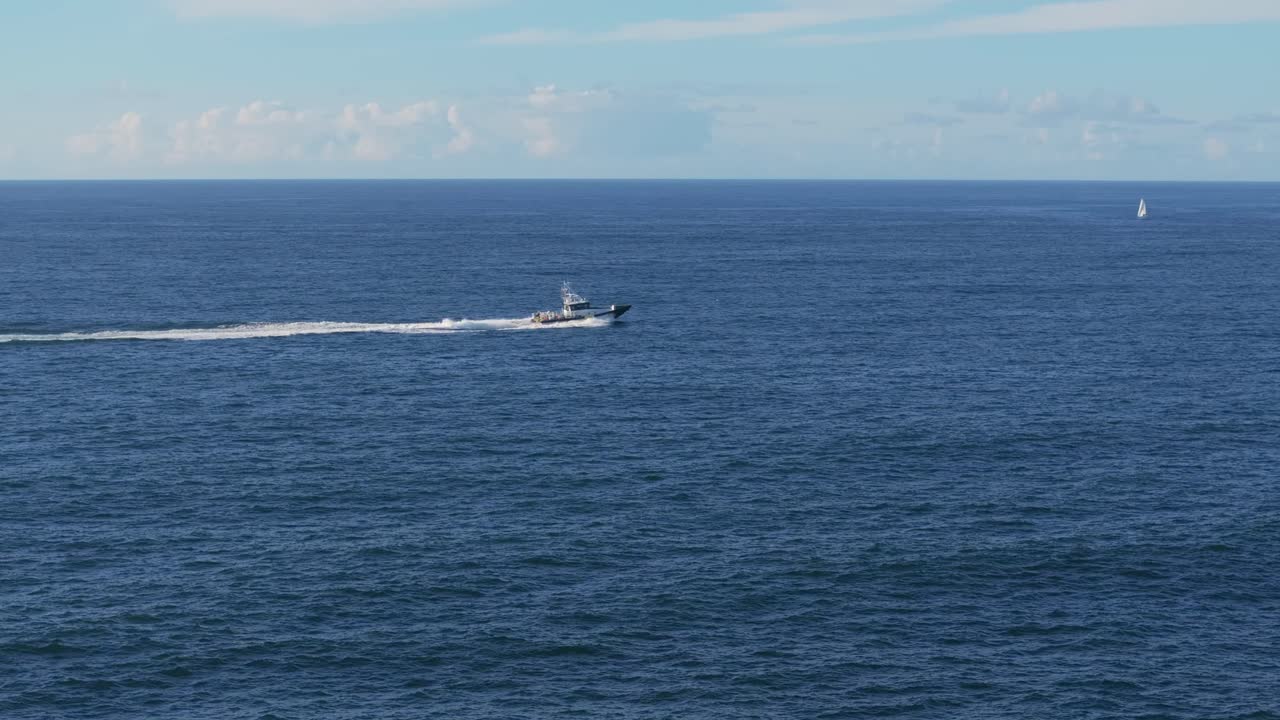 Stunning View Of Boat Cruising Across The Sea At Mera Beach In Galicia, Spain. static shot