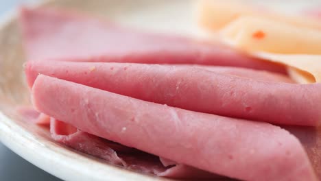 smoked meat plate with sliced ham, bacon