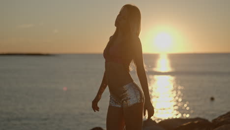 woman at sunrise by the sea