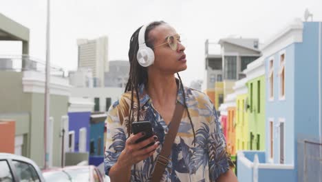 mixed race man listening to music with headphone