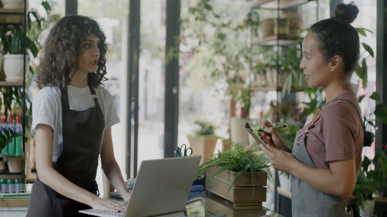 Two women working in a flower shop