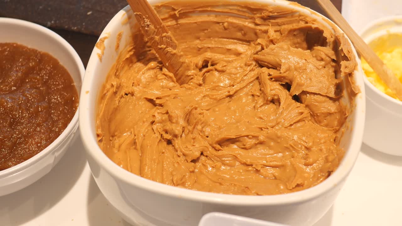 Peanut butter in a large container at cafe ,