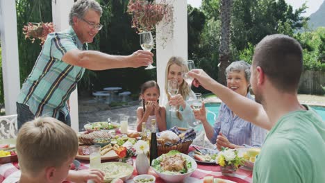 happy family eating together at table