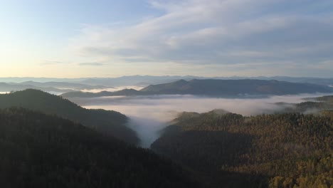 Flight-Above-Foggy-Valley-in-Siberian-Taiga