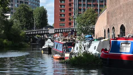 crossing the bridge in regents canal, london, united kingdom