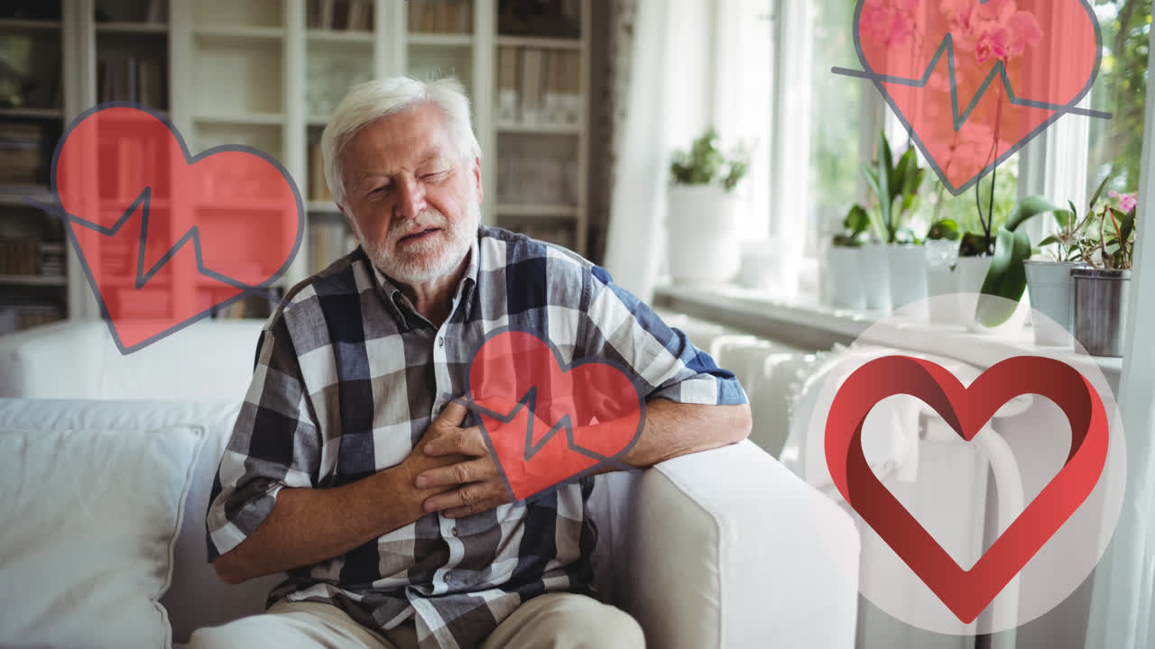 Animation of heart icons over senior caucasian man in pain holding his chest