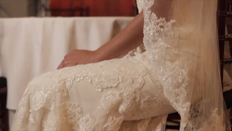 Jib-reveal-of-model-bride-sitting-in-chair-smiling-before-wedding