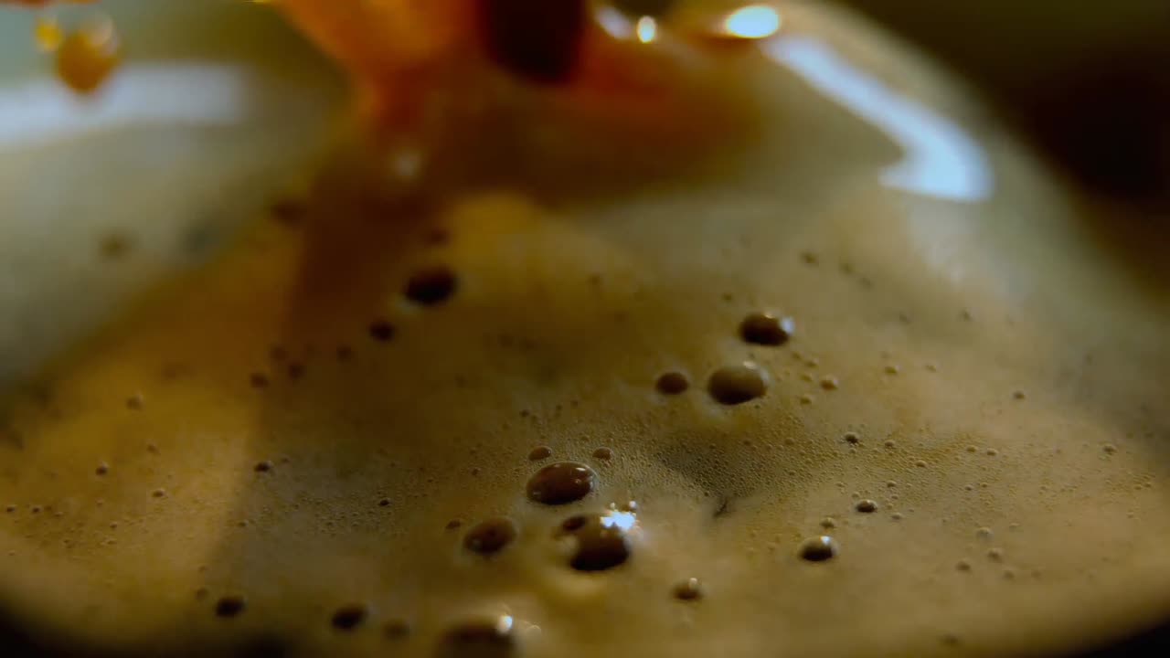 Spoon stirring cup of coffee 4k