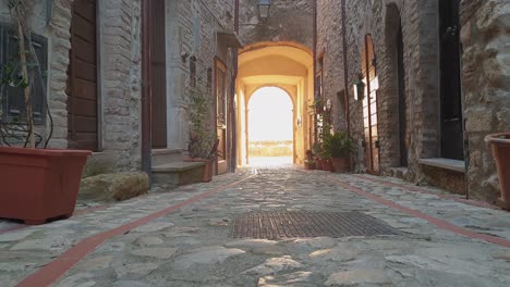 street of penna in teverina historic center with ancient entrance door in background