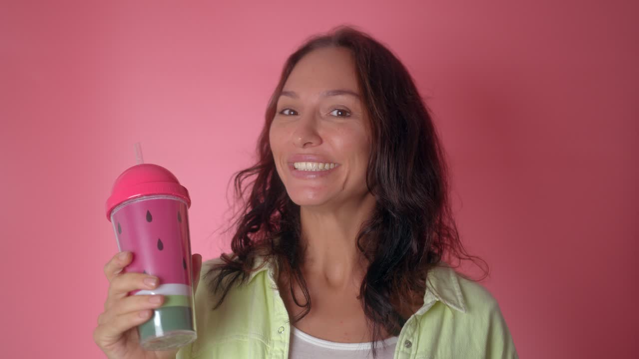 Woman Drinking from a Watermelon-Themed Cup