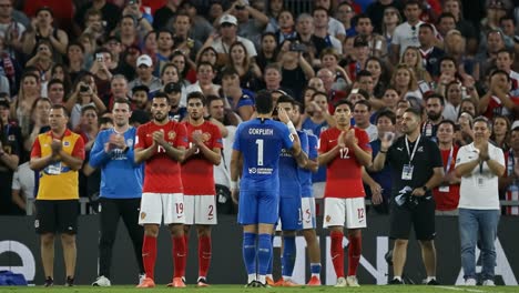 a celebratory tribute in soccer: teams honor the goalkeeper with applause at the end of a memorable match, fostering team spirit and sportsmanship