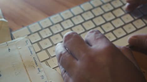 criminal investigator writing record, listening sound record, computer keyboard and fingers closeup