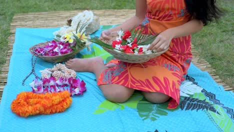 young woman holding bucket of flower in garden 4k