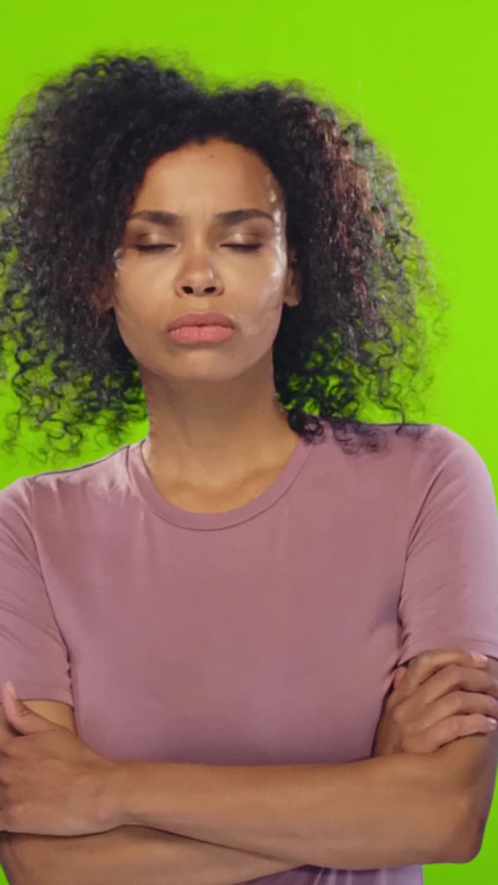 Young attractive thoughtful african american woman scratches chin and shrugging
