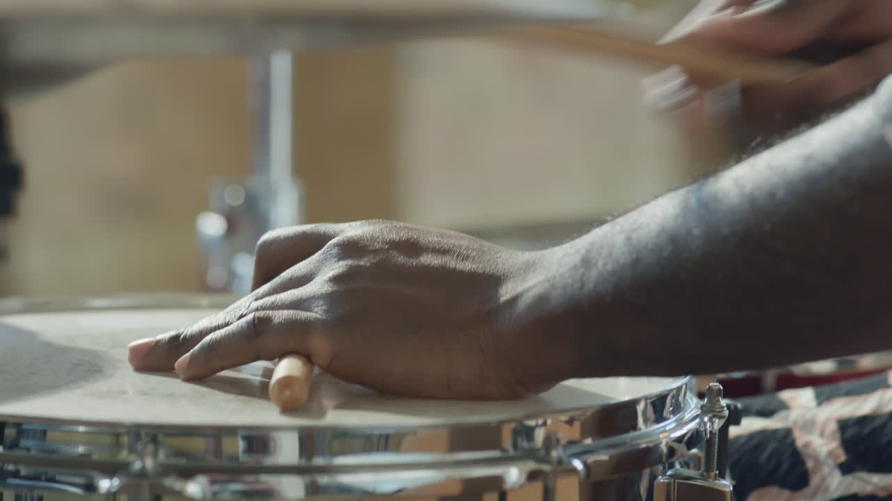 Close Up of Hands of Black Drummer Playing Drum Set