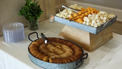 cheese cubes and crackers charcuterie party reception snack food on display table