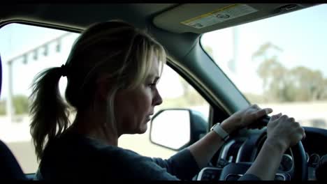 a woman driving confidently through open roads: capturing the essence of freedom and adventure behind the wheel