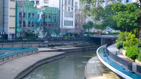 city river walk with street art mural