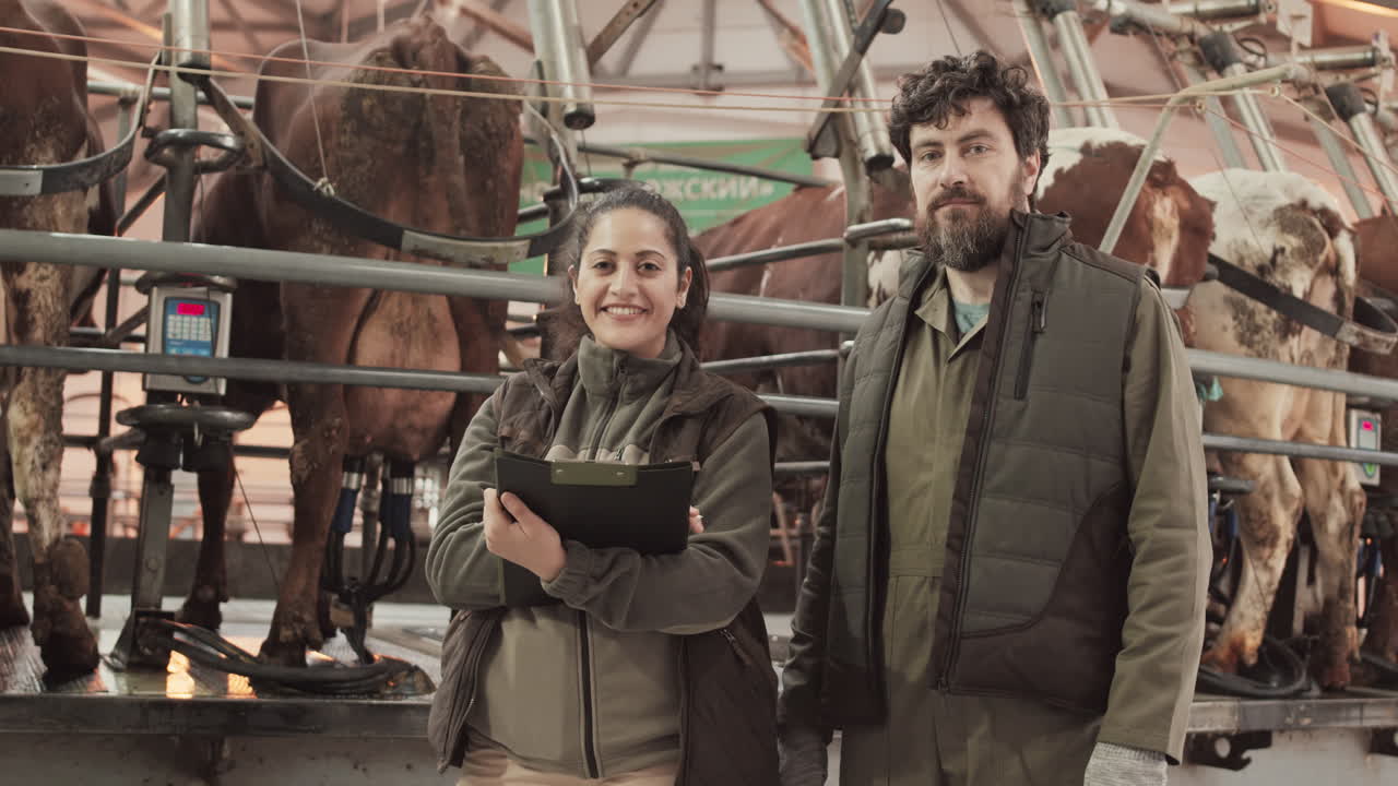 Colleagues Posing near Carousel Milking Parlor