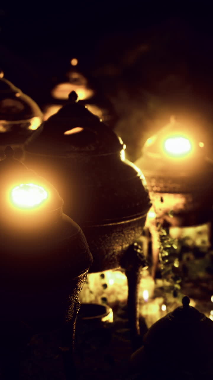 Lamps glow at a peaceful outdoor gathering during a night celebration