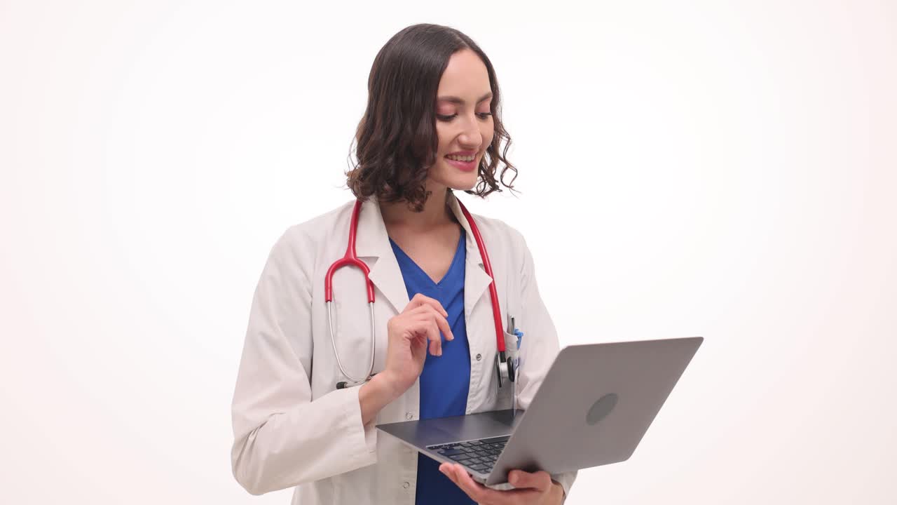 Female Doctor Engaged in Telehealth Consultation on Laptop