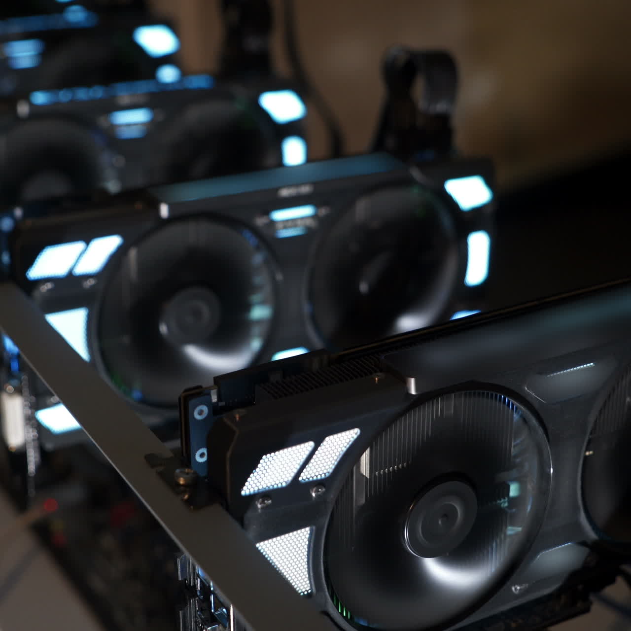 Graphics cards standing in a row in home mining farm. Close-up shot. Cryptocurrencies business.