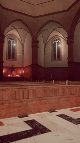 inside a dimly lit church with rows of pews and an altar with candles