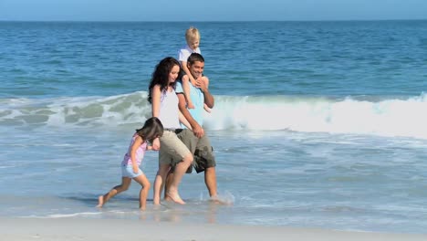 Family-walking-on-the-beach