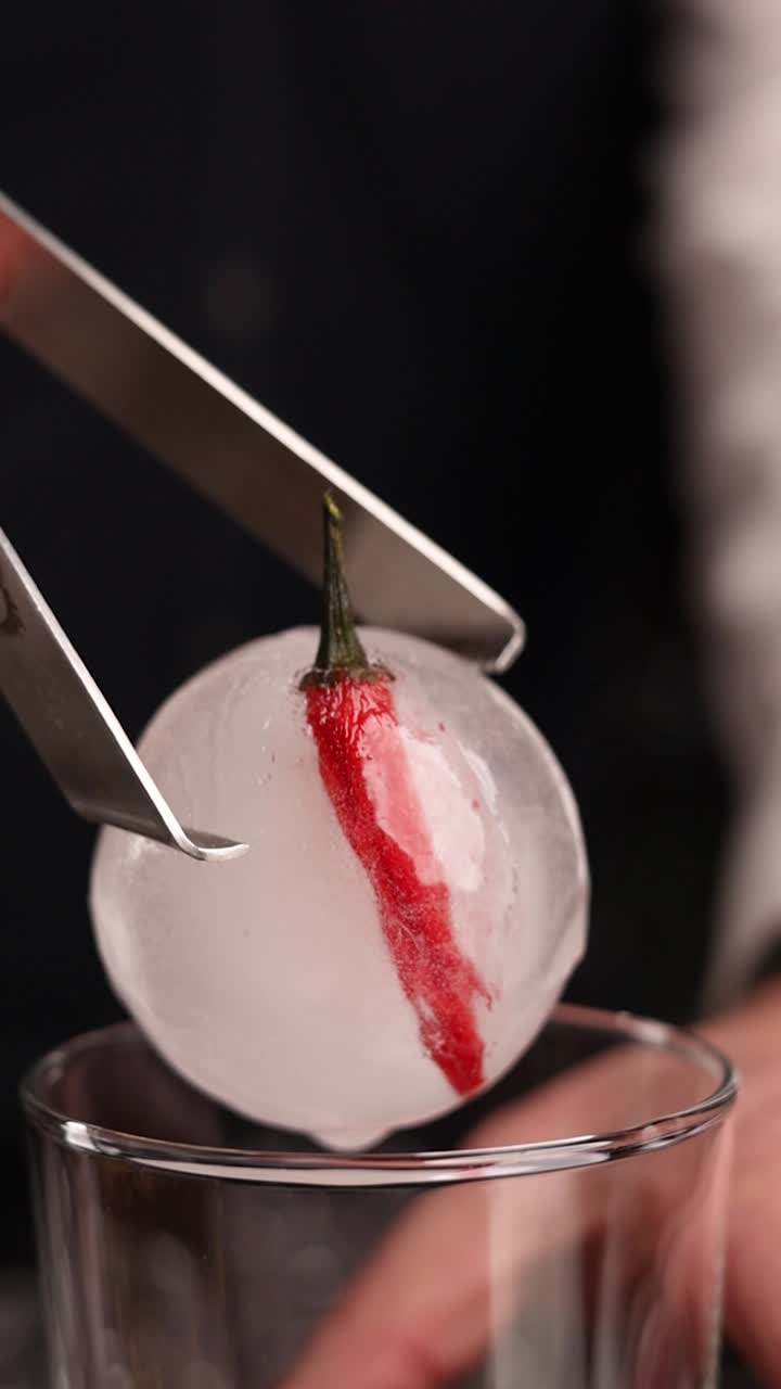 Making a Spicy Cocktail with Sphere Ice and Chili Pepper