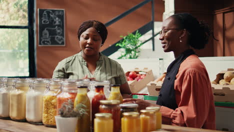 vendor showing homemade sauces and dressings to buyer