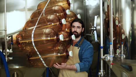 worker carrying gallons