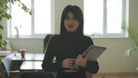 professional woman in a modern office environment, focused on work, dressed elegantly in business attire, surrounded by office equipment and a sleek interior